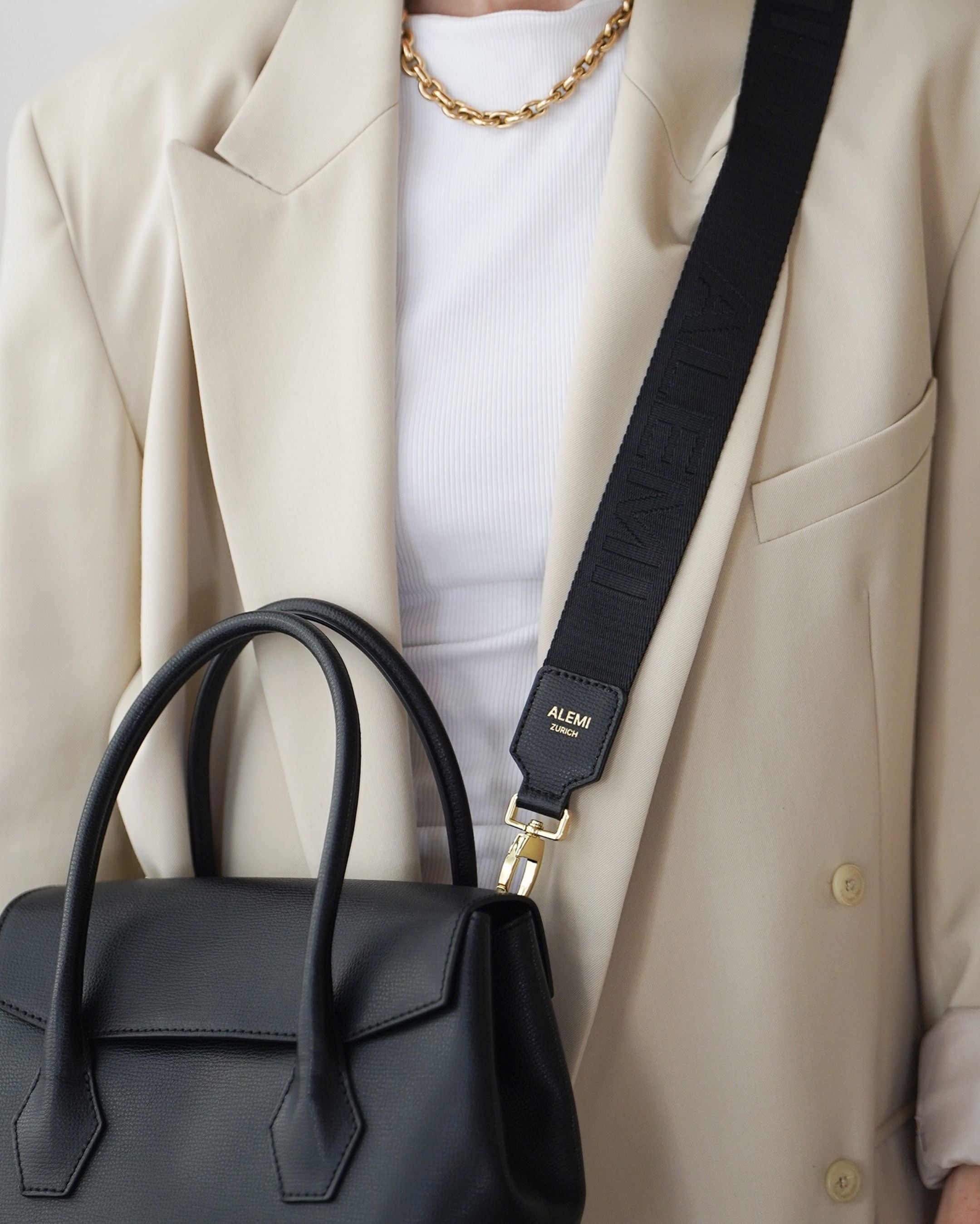 ALEMI Zurich | Adjustable Strap | Black | Pebbled Leather | Model Crossbody on Ida Small Bag