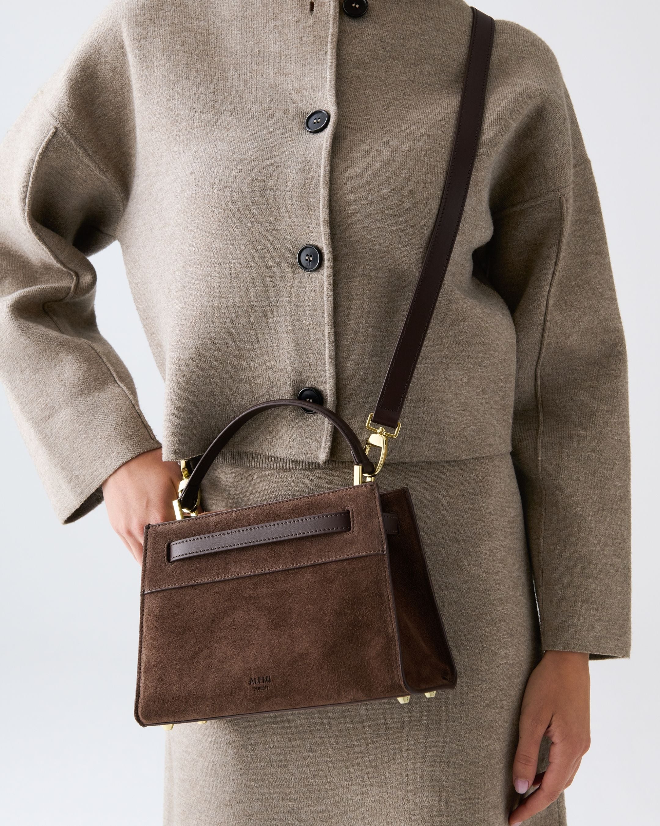 ALEMI Zurich | SEEFELD MINI | Small Bag | Dark Brown | Suede Leather | Model carrying bag by strap close up