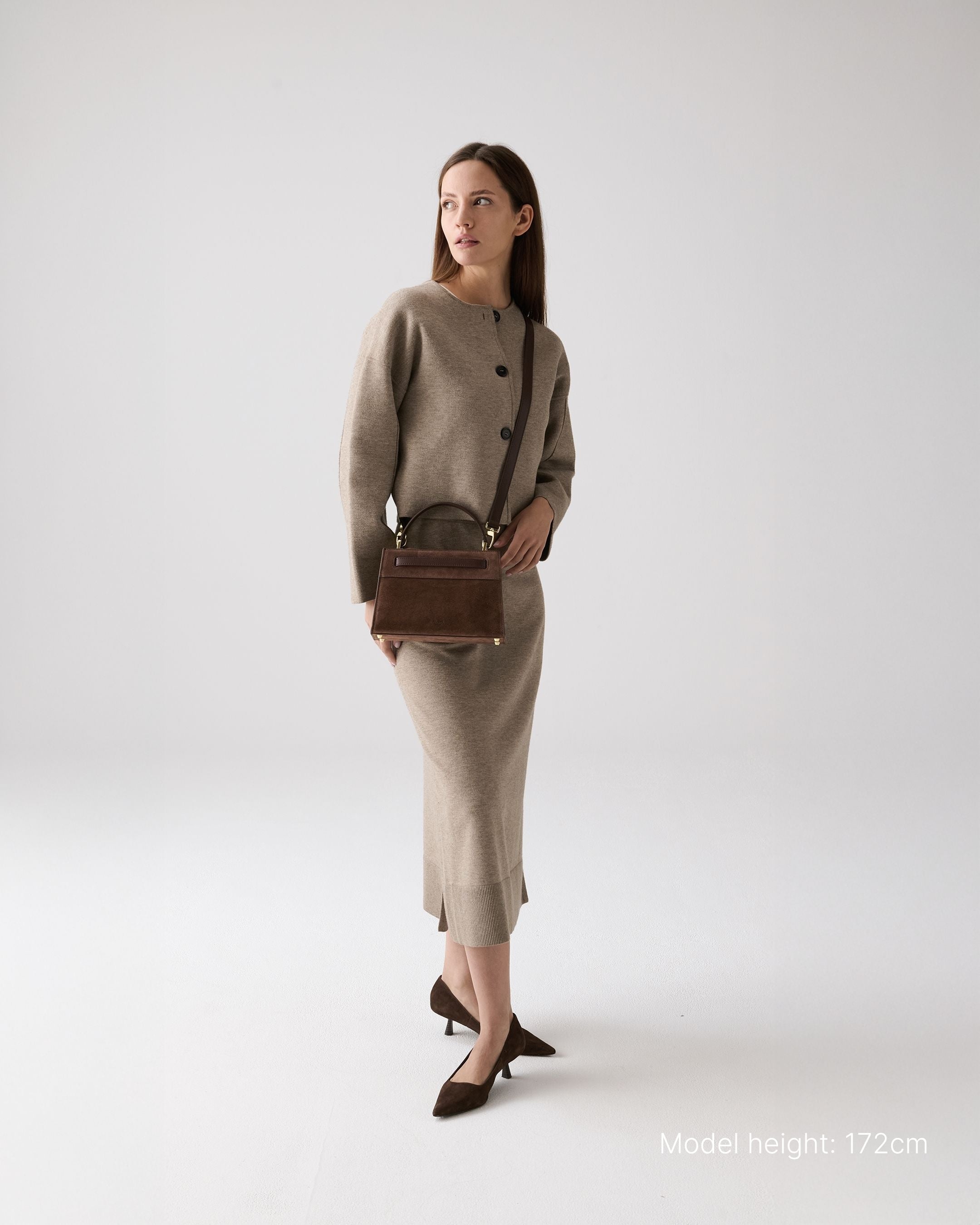 ALEMI Zurich | SEEFELD MINI | Small Bag | Dark Brown | Suede Leather | Model carrying bag by strap