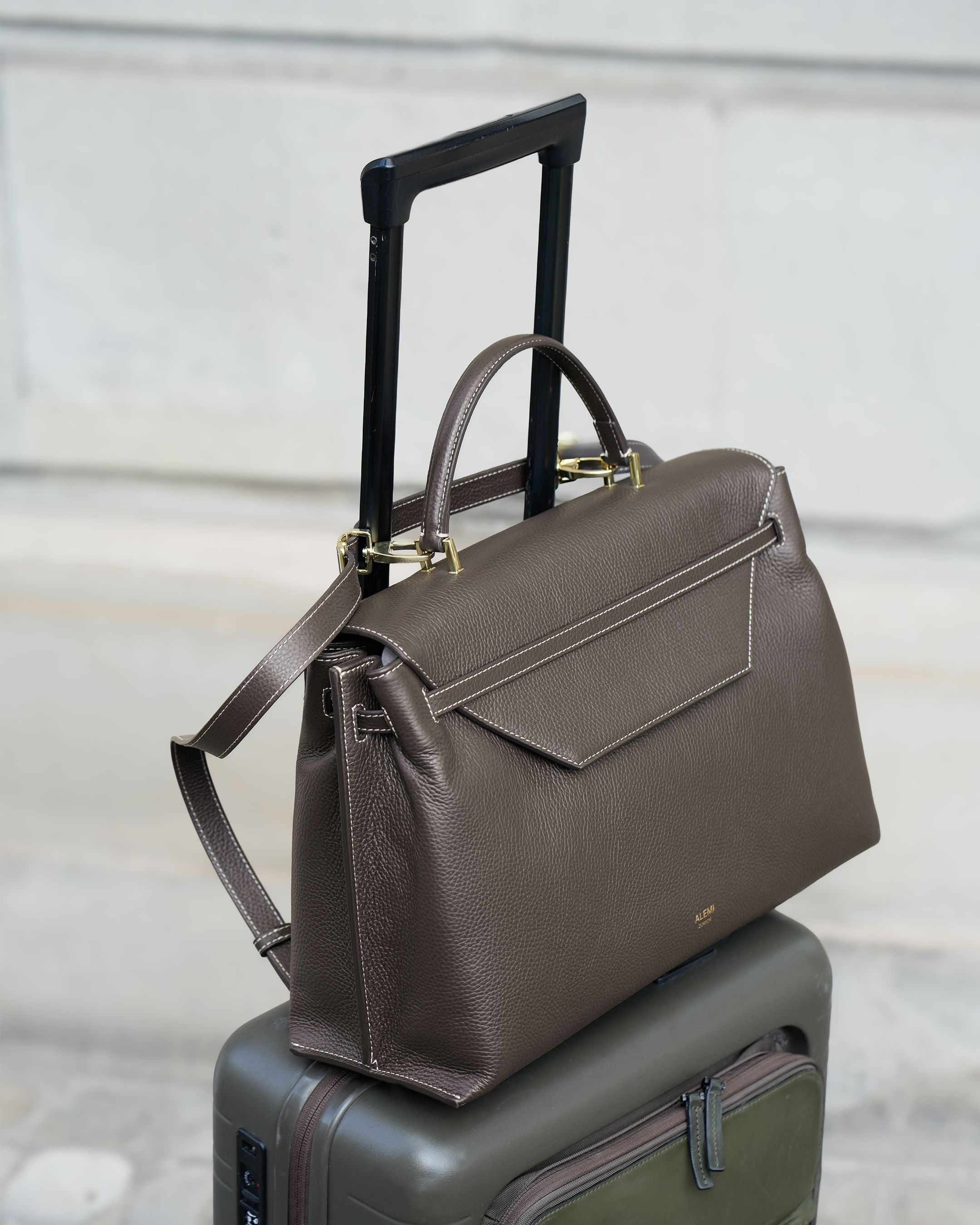 ALEMI Zurich | VIADUKT WORK | Laptop Bag | Dark Brown | Soft Grain Leather | Bag on suitcase